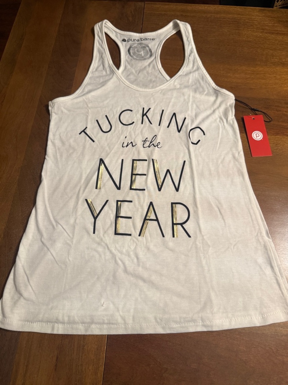 Pure Barre White Racerback Tank with 'Tucking in the New Year' Graphic